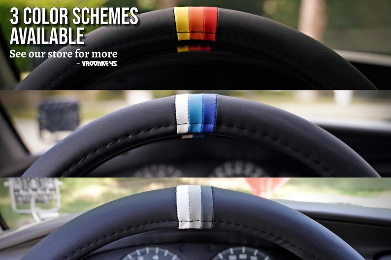 May include: Three steering wheel covers with different colored stripes. The top cover has red, orange, and yellow stripes. The middle cover has blue, white, and light blue stripes. The bottom cover has gray, white, and black stripes.