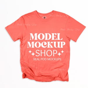 May include: Coral colored t-shirt with white text that reads "MODEL MOCKUP SHOP" and "REAL POD MOCKUPS".