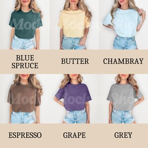 以下が含まれることがあります： クロップドTシャツの異なる色を9枚の画像で紹介したコラージュ。色はブルー・スプルース、バター、シャンブレー、エスプレッソ、グレープ、グレーです。