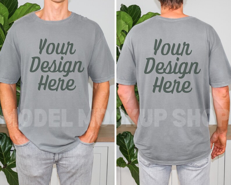 Peut inclure: Un t-shirt gris &agrave; manches courtes et col rond. Le t-shirt a le texte "Your Design Here" imprim&eacute; sur le devant et le dos en vert fonc&eacute;.