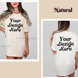 May include: A white oversized t-shirt mockup with the text "Your Design Here" on the front and back. The shirt is made of a natural fabric and has a relaxed fit.