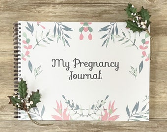 May include: A white spiral bound journal with a floral design and the text "My Pregnancy Journal".