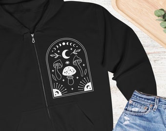May include: Black zip-up hoodie with a white graphic of mushrooms, a crescent moon, and stars inside an arched frame.