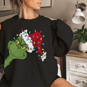 Grinch Christmas Lights Sweatshirt, Holiday Grinchmas Hoodie, Grinch Santa Hat Xmas Sweatshirt, Merry Christmas 2025 Feeling Extra Grinch