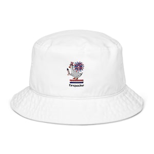 May include: A white bucket hat featuring an embroidered graphic of a goose wearing a red, white, and blue top hat, holding a firework, with a firework burst behind it, a red, white, and blue striped bar, and the text firequacker below.