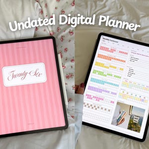May include: Two tablets displaying a digital planner. One tablet shows a pink striped cover with the text "Twenty Six" in a white frame. The other tablet displays a colorful monthly dashboard. The text "Undated Digital Planner" is at the top.