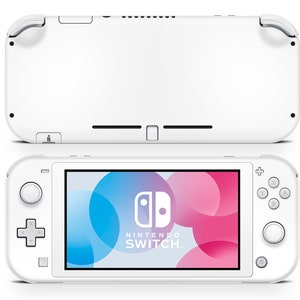 May include: A white Nintendo Switch console, shown from the front and back. The front view displays the screen with the Nintendo Switch logo and a colourful abstract design. The back view shows the console's features.