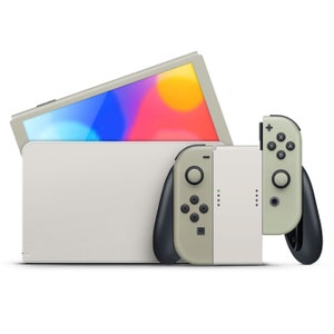 May include: A white Nintendo Switch console with a gray and black Joy-Con controller. The console is in a closed position with the screen facing up. The screen is displaying a colorful abstract design.