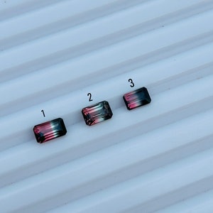May include: Three rectangular gemstones with a gradient of pink, black, and green colours. The gemstones are labelled 1, 2, and 3.