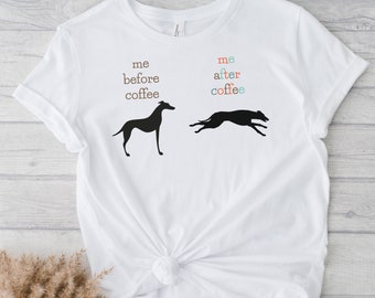 May include: White t-shirt with a black silhouette of a dog before and after coffee. The text reads "me before coffee" and "me after coffee".