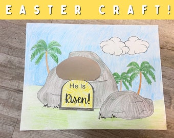May include: A hand-drawn Easter craft depicting a tomb with a large stone rolled away. The tomb is decorated with a yellow sign that reads "He is Risen!"  Two palm trees and clouds are drawn in the background.
