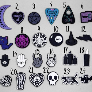 May include: Twenty-four black and white iron-on patches with various designs, including a crescent moon, a heart with the text "magic af", a pentagram, a Ouija board, a witch, a cat, a hand with an eye, a skull, a ghost, and a candle.