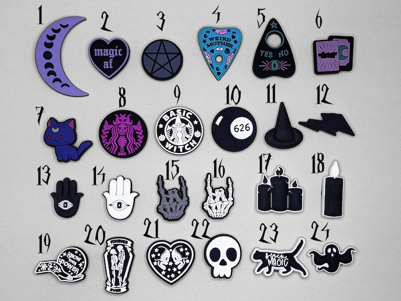 May include: Twenty-four black and white iron-on patches with various designs, including a crescent moon, a heart with the text "magic af", a pentagram, a Ouija board, a witch, a cat, a hand with an eye, a skull, a ghost, and a candle.