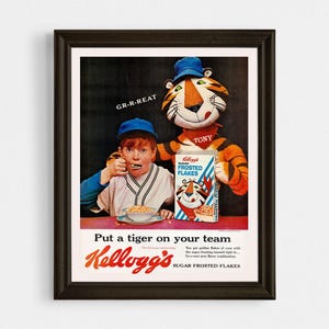 May include: A vintage Kellogg's Sugar Frosted Flakes cereal box ad featuring Tony the Tiger and a young boy wearing a baseball uniform. The ad text reads "Put a tiger on your team Kellogg's Sugar Frosted Flakes".
