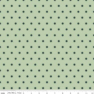 May include: A green fabric with a repeating pattern of dark green polka dots.