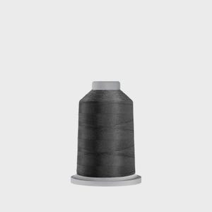 May include: A spool of dark gray thread, ideal for sewing and embroidery projects. The thread is tightly wound around a gray plastic core, with a matching gray top and base. The thread appears smooth and has a slight sheen.