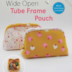 May include: Two fabric pouches with metal tube frames. One pouch is mustard yellow with pink and white strawberry prints. The other is cream with a multi-colored floral and rainbow pattern. Text reads: Wide Open Tube Frame Pouch, Hardware Included.