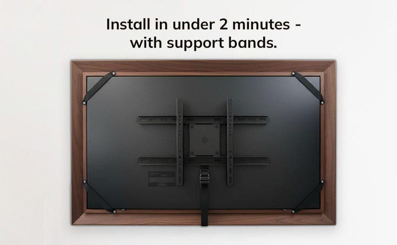 a television mounted on a wall, with instructions on how to install it.