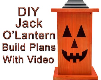 May include: DIY Jack O'Lantern Build Plans With Video - A wooden jack-o'-lantern lantern with a black roof and orange paint. The lantern has a carved face with triangular eyes, a triangular nose, and a wide, toothy smile.