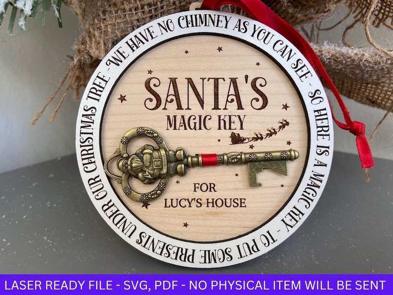 May include: A white wooden ornament with the text "Santa's Magic Key" and "For Lucy's House". The ornament also has a gold-colored key with a Santa figure on it.