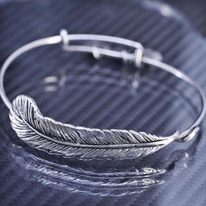 8” adjustable, vintage Alex and Ani silver tone bangle, bracelet with feather and charms,stamped Alex and Ani