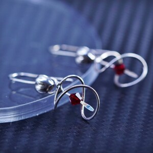 Vintage sterling silver 925 handmade twisted earrings with red crystal, stamped 925