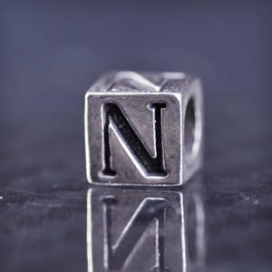 Vintage sterling silver 925 handmade tag bead cube charm embossed “N”, stamped 925