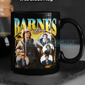May include: Black ceramic mug with a graphic of a man with a crown and the text "BARNES Ben" in yellow letters. The mug also features images of four other men in circular frames.