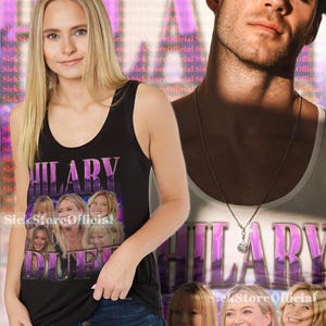 May include: Black tank top featuring the name "HILARY DUFF" in purple, with images of Hilary Duff. The background includes a man and text that says "SickStoreOfficial".