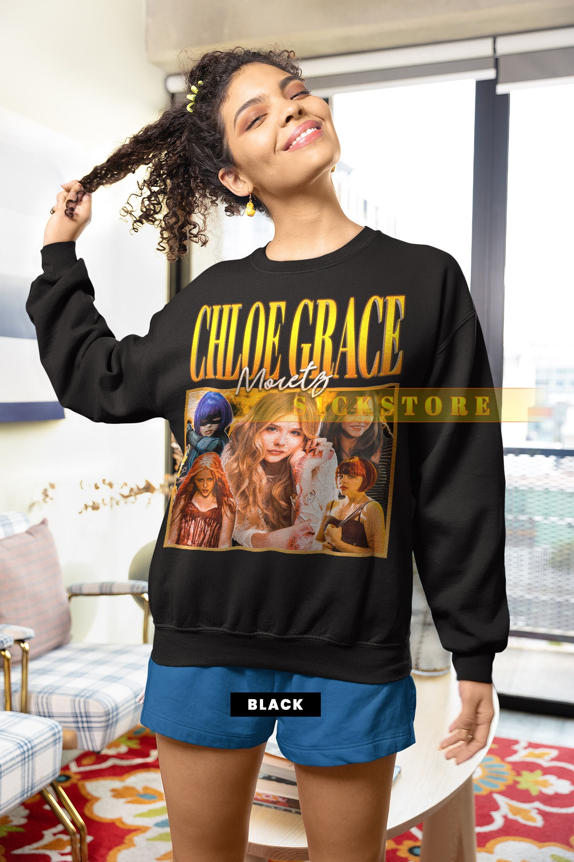 Chloe Grace Moretz sports a black hoodie and leggings while