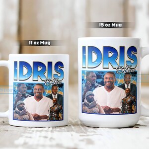Puede incluir: Dos tazas de cer&aacute;mica blanca con una imagen colorida de Idris Elba. La taza m&aacute;s grande es de 15 onzas y la taza m&aacute;s peque&ntilde;a es de 11 onzas. Ambas tazas muestran el texto "Idris Elba" en letras azules y amarillas.
