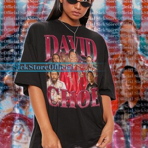 May include: Black oversized t-shirt featuring a graphic of a group of men with the text "DAVID CHOI" in a pink, distressed font. The shirt is a unisex style.