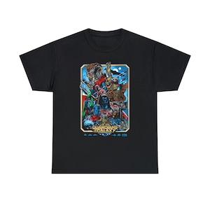 May include: Black t-shirt featuring a colorful graphic of characters from the movie "Guardians of the Galaxy." The design includes various characters in a rectangular frame with the movie title at the bottom. The Marvel logo is also visible.