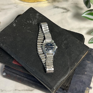 Vintage Timex Electric Ladies Watch Blue Dial Silver Tone Bracelet 1970s Water Resistant Stainless Steel Timepiece