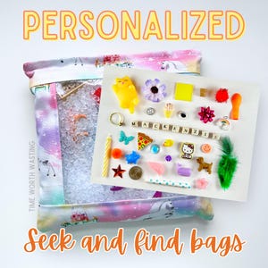 May include: A personalized seek and find bag with a rainbow unicorn design. The bag is filled with clear plastic beads and a variety of small toys, including a pizza slice, a cat, a butterfly, and a yellow duck. The bag is labeled "TIME WORTH WASTING" and "Seek and find bags".