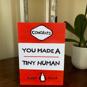 Carte de voeux You Made a Tiny Human - Couverture de livre de pingouin