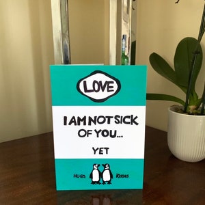 Not Sick Of You Yet - Pinguin Buch Cover Grußkarte