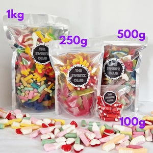 May include: Assorted colorful candies in clear plastic bags, labeled with weights: 1kg, 250g, 500g, and 100g. Each bag features a circular logo that reads "THE SWEETZ CLUB". A variety of candies are scattered in front.