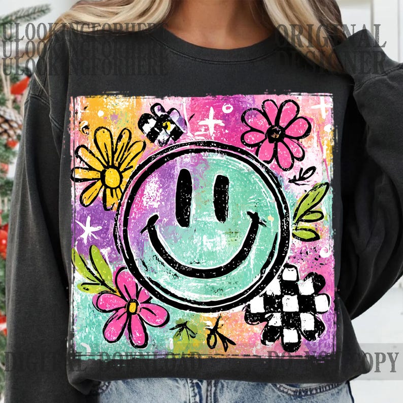 Puede incluir: Sudadera negra con un dise&ntilde;o gr&aacute;fico colorido. Presenta una cara sonriente turquesa, rodeada de flores rosas y amarillas, una mariposa a cuadros y estrellas. El fondo es una mezcla de colores. El estilo general es alegre y brillante.