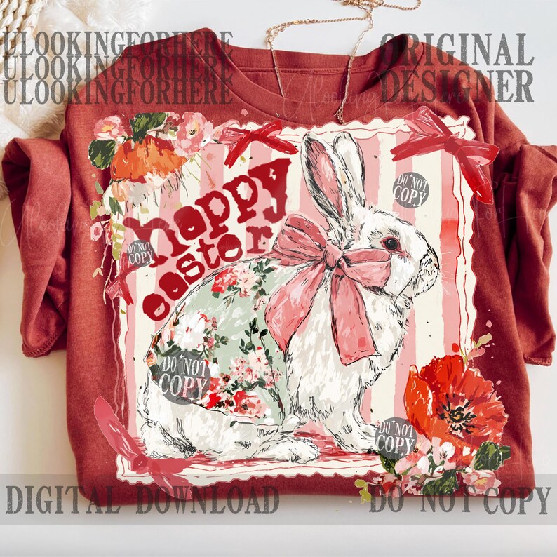 K&ouml;nnte beinhalten: Ein weinrotes T-Shirt mit einer Grafik eines wei&szlig;en Kaninchens mit rosa Schleife und Kleidung mit Blumenmuster. Die Worte "Happy Easter" sind rot gedruckt. Blumenakzente und der Text "Digital Download" sind ebenfalls sichtbar.