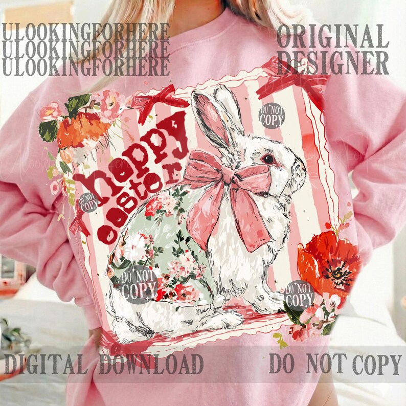 K&ouml;nnte beinhalten: Hellrosa Sweatshirt mit einem Grafikdruck. Der Druck zeigt ein wei&szlig;es Kaninchen mit einer rosa Schleife und Blumenmuster, sowie den Schriftzug "Happy Easter". Rote Blumen und Schleifen sind ebenfalls zu sehen. Die Worte "Digital Download" sind ebenfalls sichtbar.