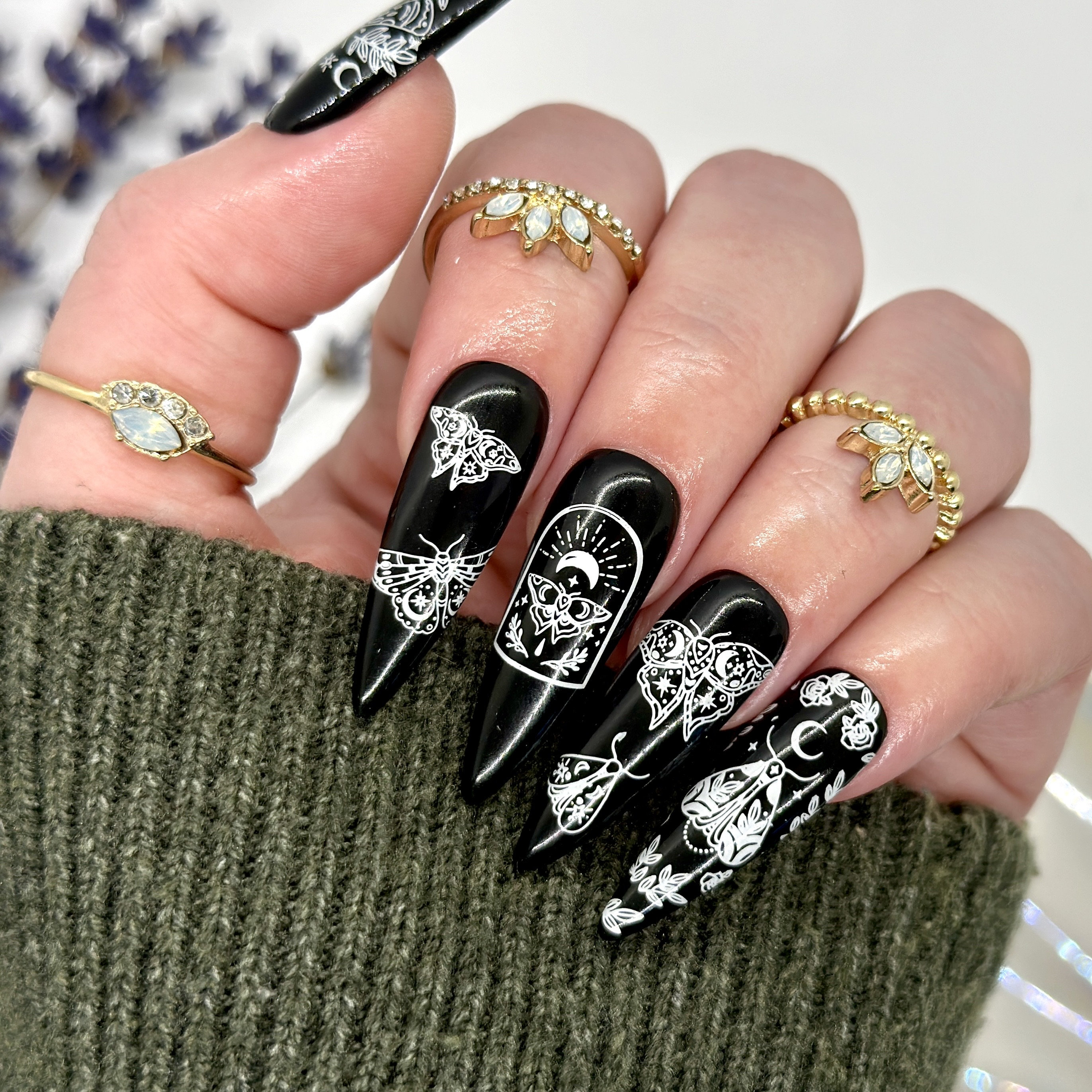 Edgy Black Faux Moth Nail Design