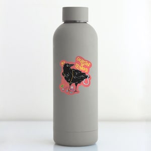 May include: A gray water bottle with a sticker of a black crow with a pearl necklace and the text "Collector of Trinkets".