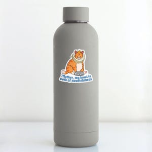 May include: A gray water bottle with a sticker of an orange cat wearing a crown and a ruff. The sticker says "Mother, my bowl is void of nourishment."