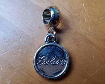 Silver medallion charm w/ engraved Believe