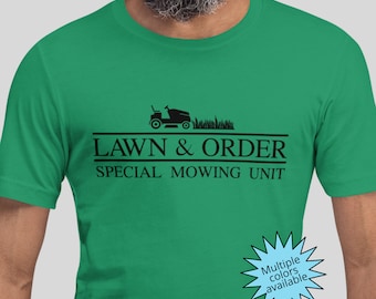 May include: Green t-shirt with a black lawnmower graphic and the text "LAWN & ORDER SPECIAL MOWING UNIT".