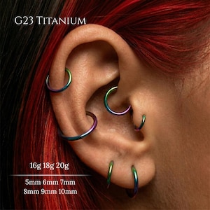 May include: A set of three ceramic mugs with a speckled, matte finish in cream, light brown, and dark brown. Each mug has a simple design and a rounded handle.