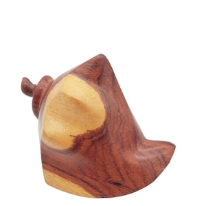 May include: A wooden, hand-carved, brown and yellow, decorative object with a unique shape.