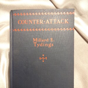 May include: A dark blue book with the title "COUNTER-ATTACK" in red lettering. The author's name, Millard E. Tydings, is printed in red below the title.