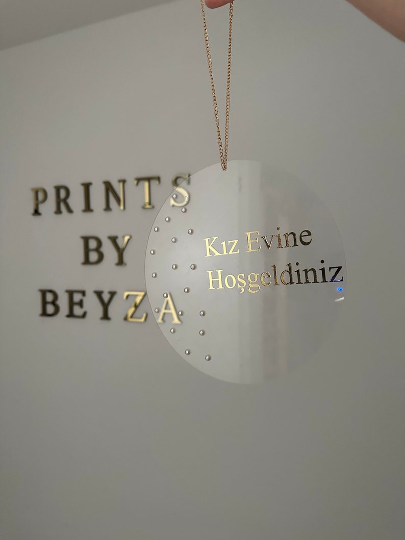 May include: A rustic wooden sign with the text "Welcome to our porch" in white lettering. The sign features a distressed finish and a simple, inviting design, perfect for outdoor decor.
